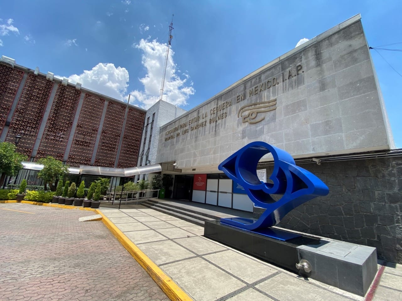 Young woman wearing glasses smiles