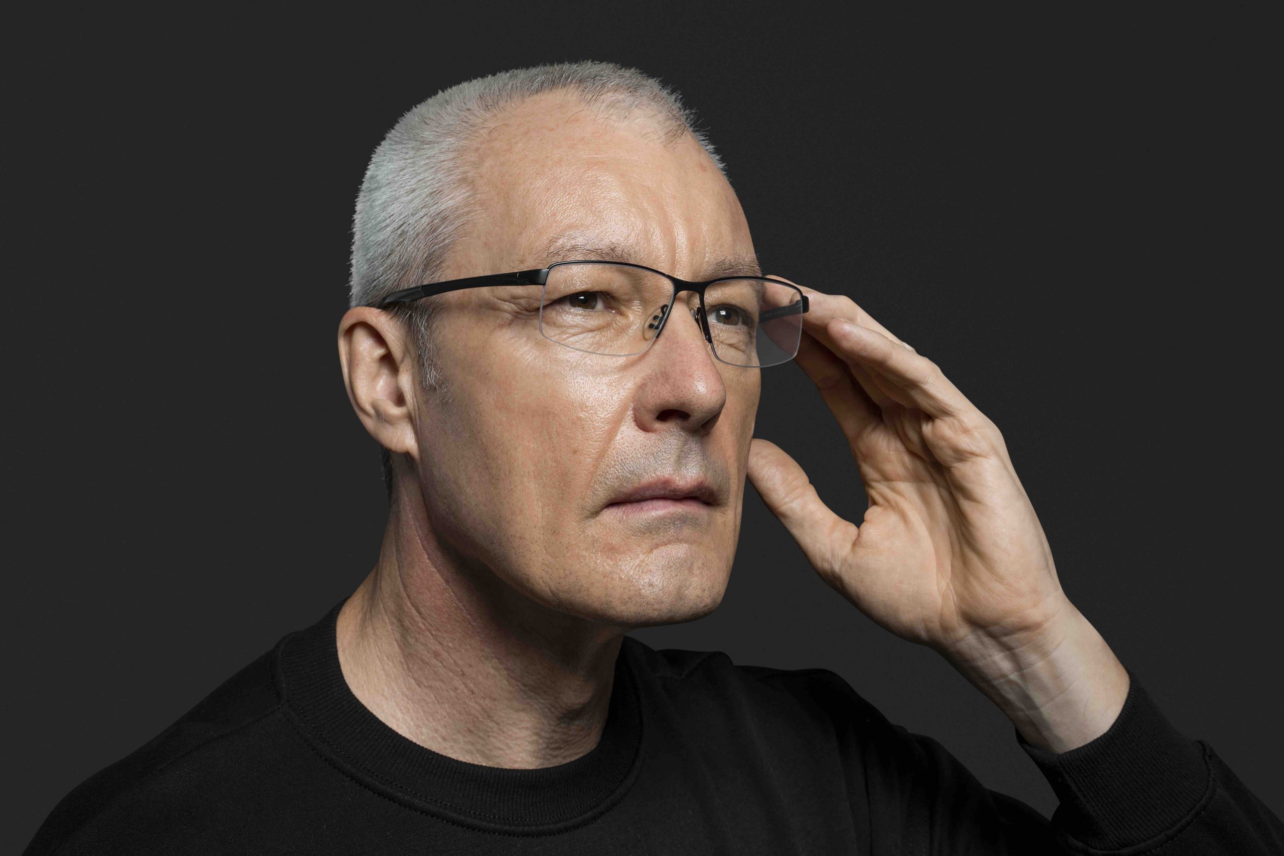 Young woman wearing glasses smiles