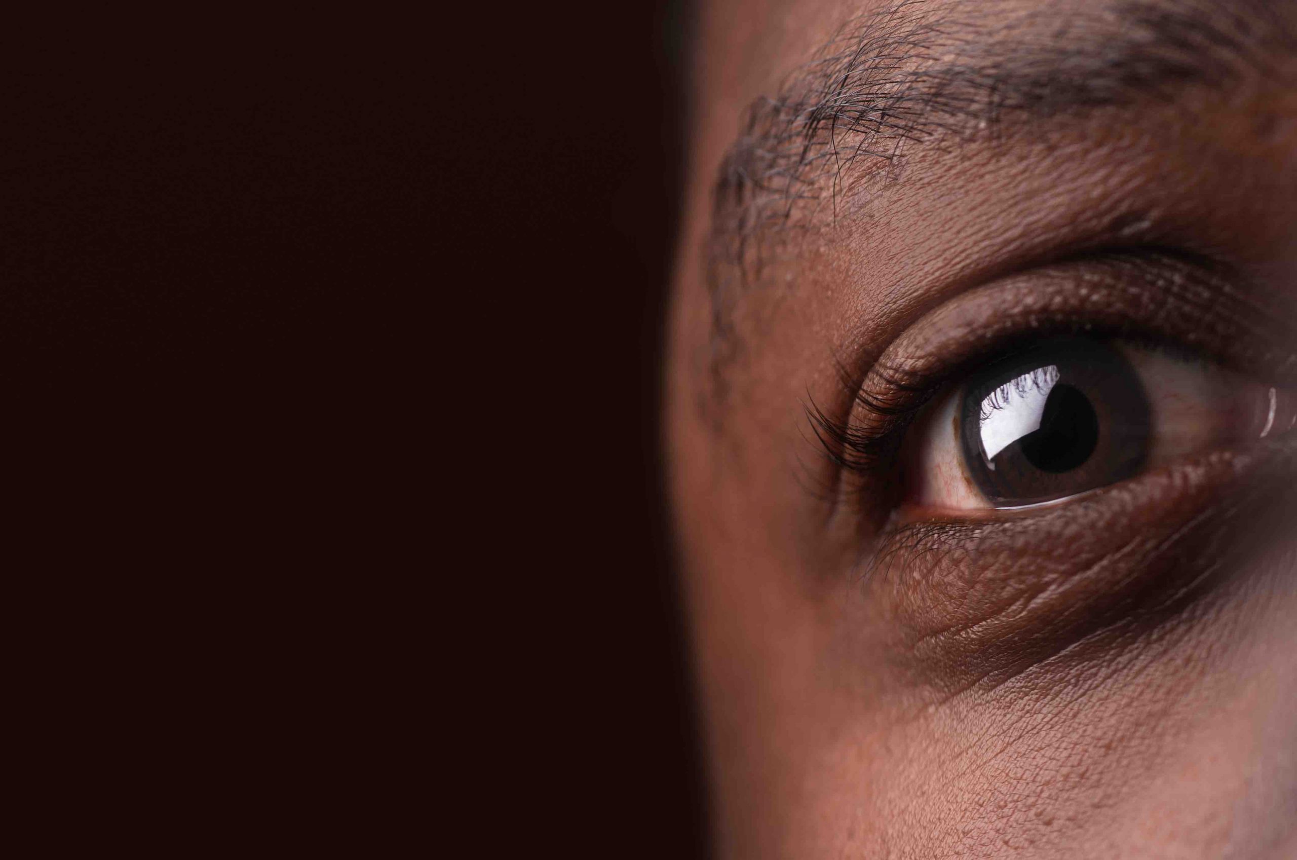 Young woman wearing glasses smiles