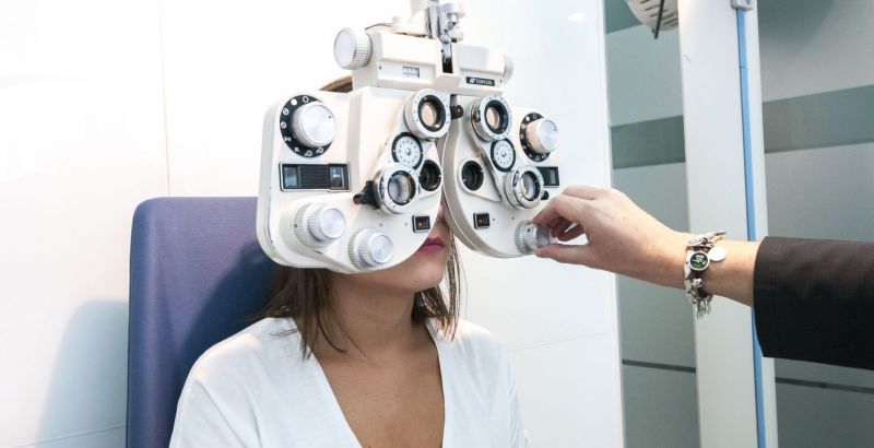 Young woman wearing glasses smiles