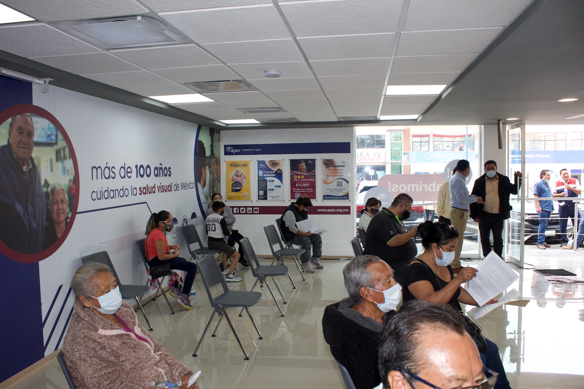 Young woman wearing glasses smiles