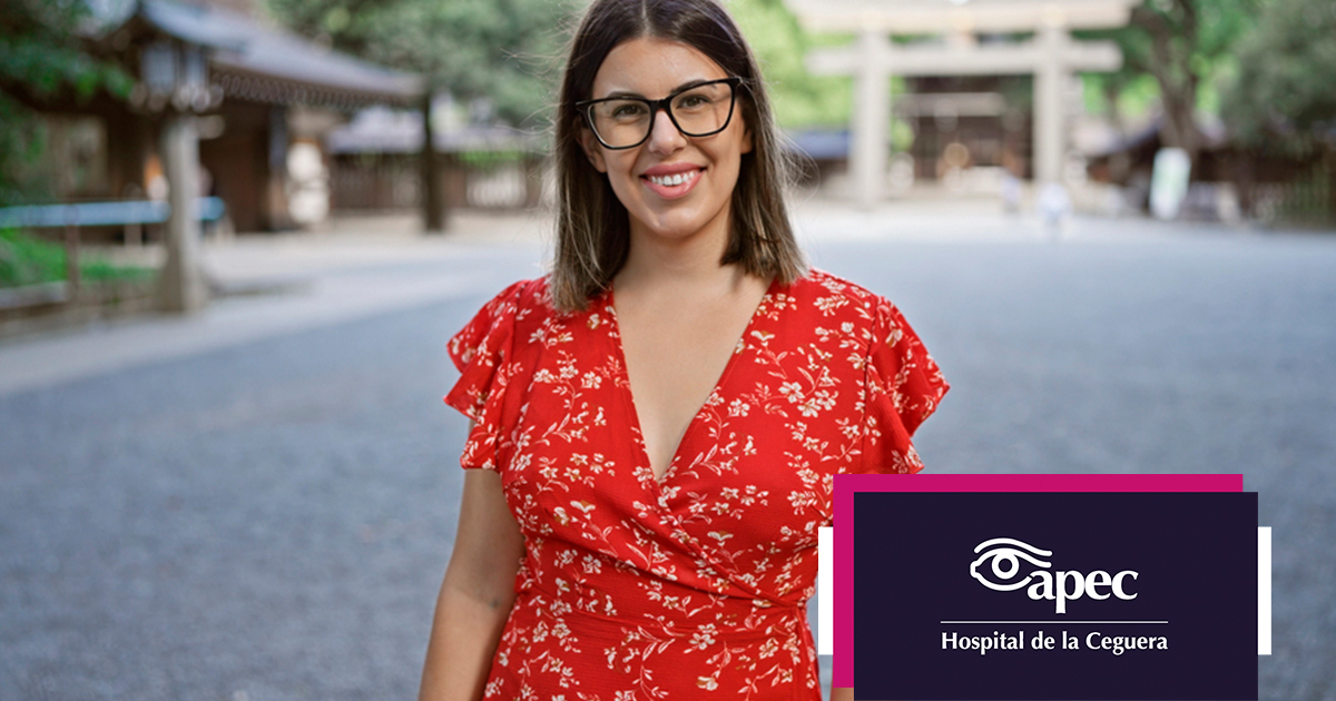 Young woman wearing glasses smiles