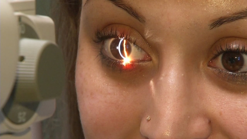 Young woman wearing glasses smiles