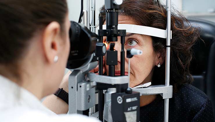 Young woman wearing glasses smiles
