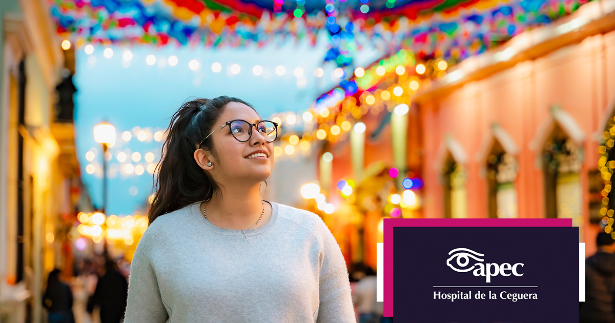 Young woman wearing glasses smiles