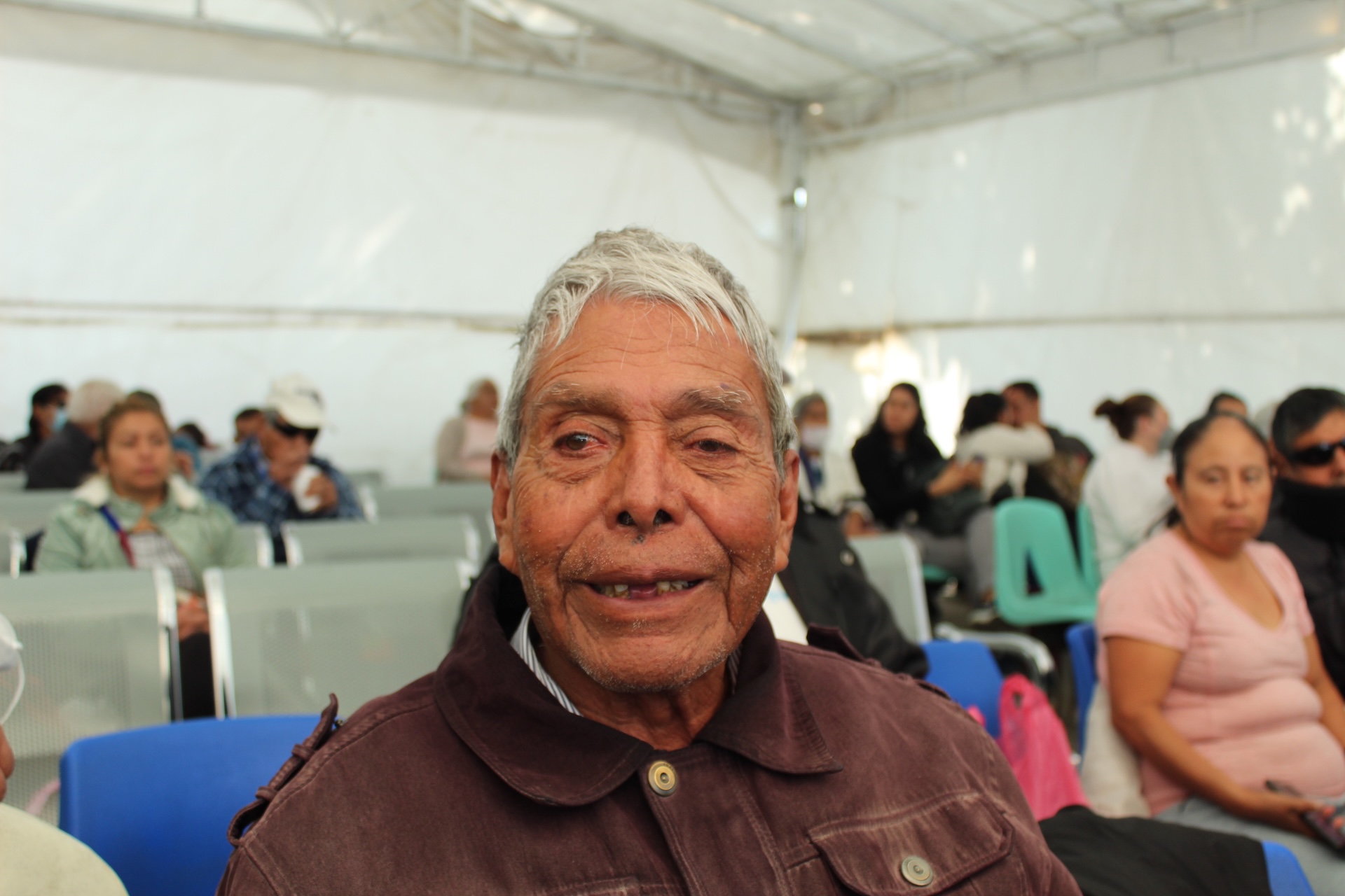 Young woman wearing glasses smiles