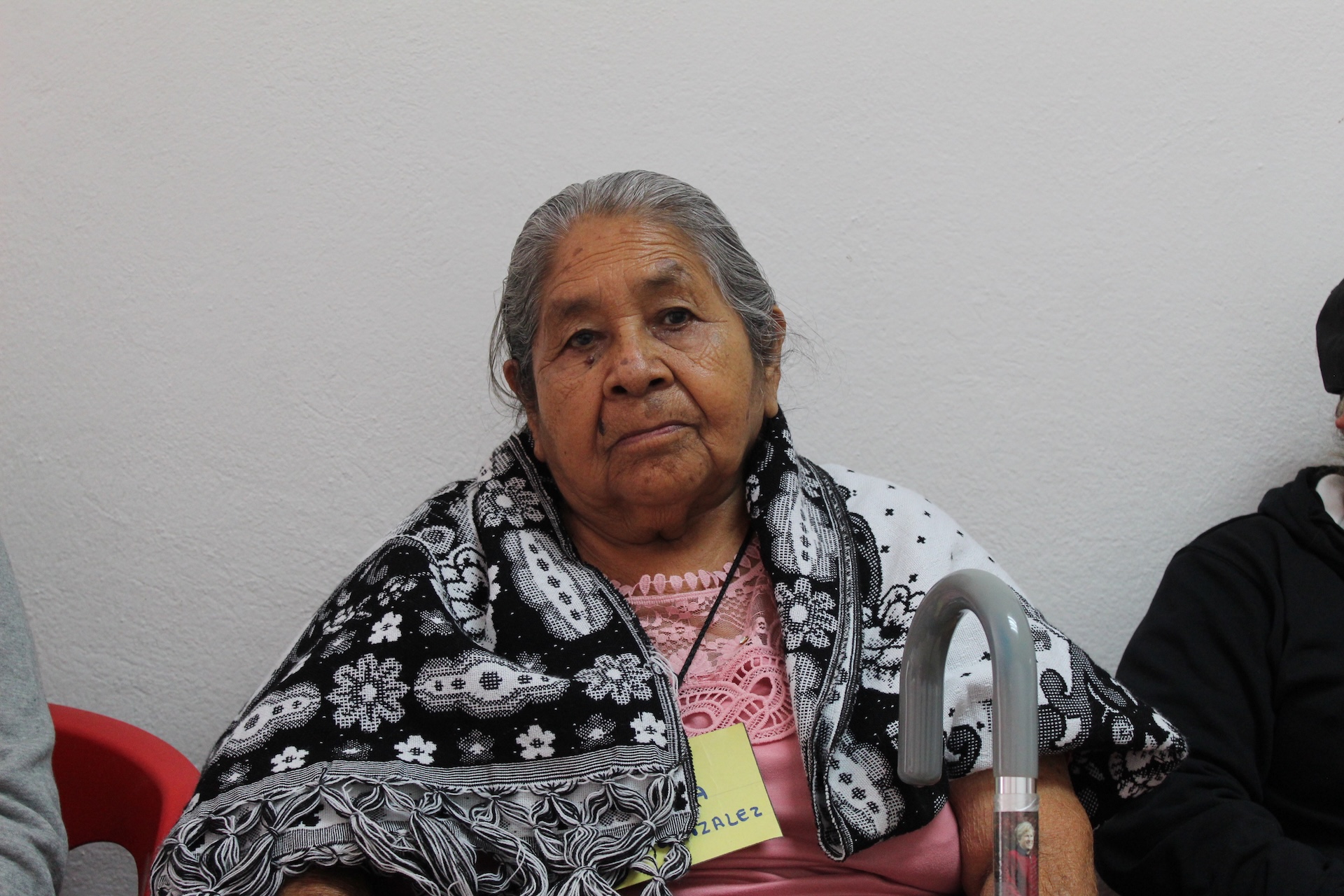 Young woman wearing glasses smiles