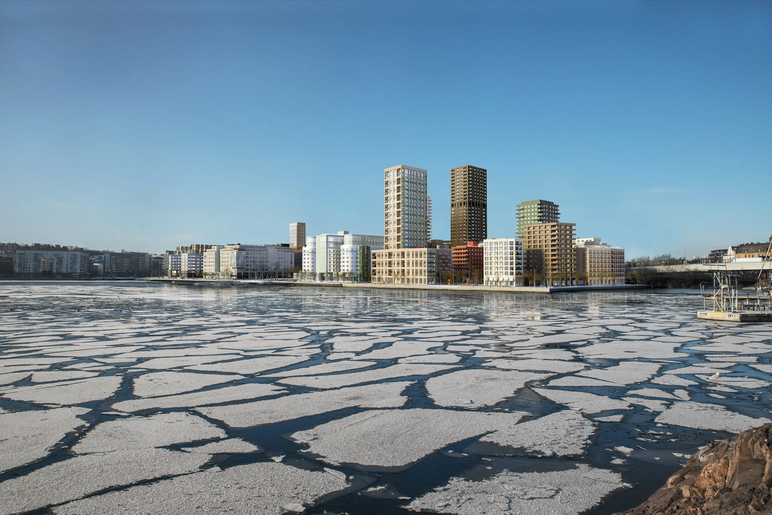 Radiance Visual. Modern residential buildings along a waterfront with partially frozen water under a clear blue sky.