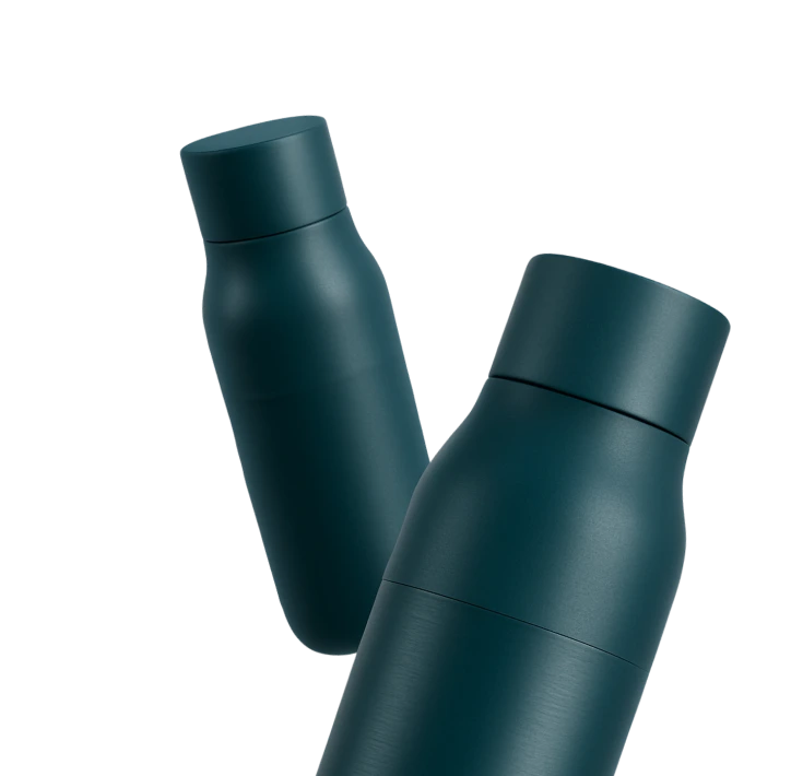 Radiance Visual. Two dark teal insulated water bottles with matte finish, one slightly blurred in the background.