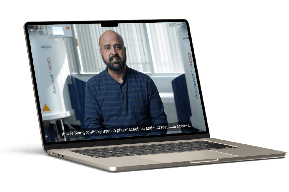 Laptop mockup displaying a corporate video interview with a professional discussing pharmaceutical and nutraceutical applications.