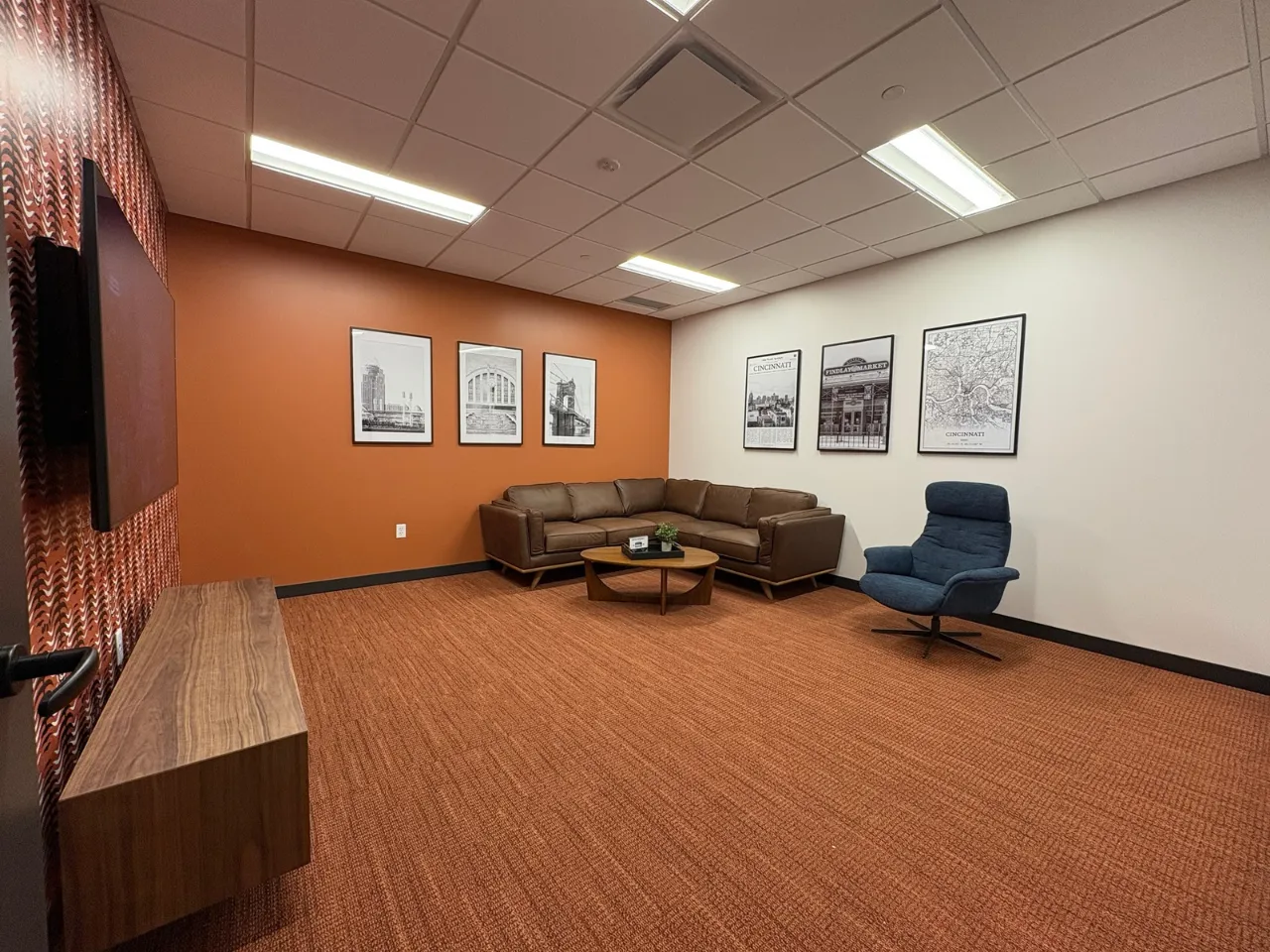 Lobby and collaboration lounge at Power Home Remodeling Group’s Cincinnati regional office, featuring modern finishes and open gathering spaces built by Oswald Company.