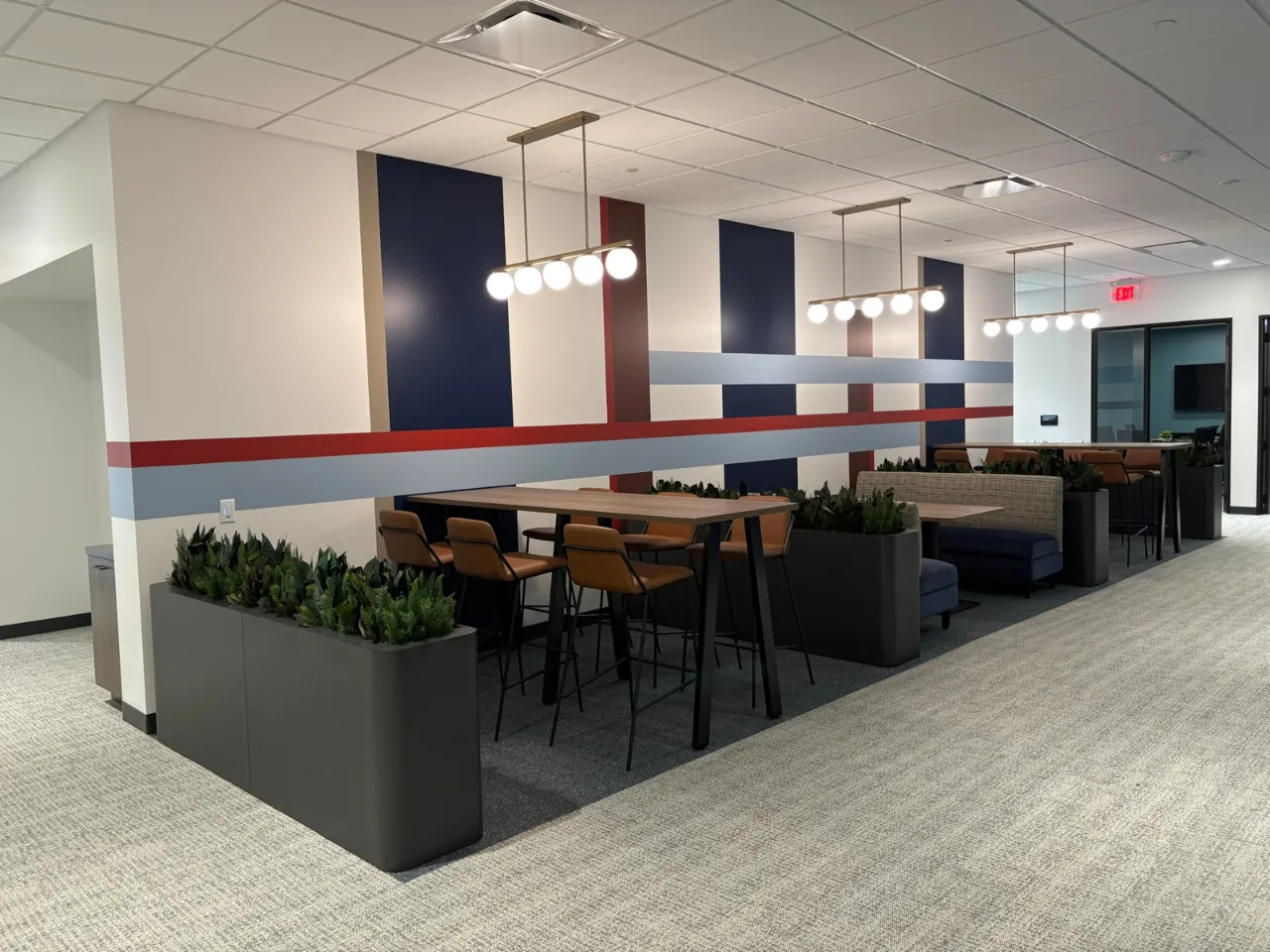 Collaboration seating at Power Home Remodeling Group’s Cincinnati regional office, featuring modern finishes and open gathering spaces built by Oswald Company.