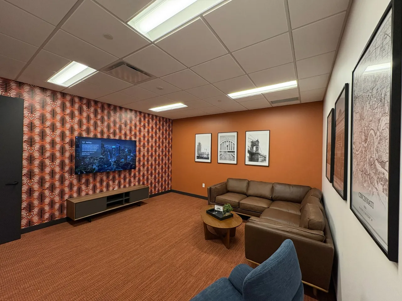 Lobby and collaboration lounge at Power Home Remodeling Group’s Cincinnati regional office, featuring modern finishes and open gathering spaces built by Oswald Company.
