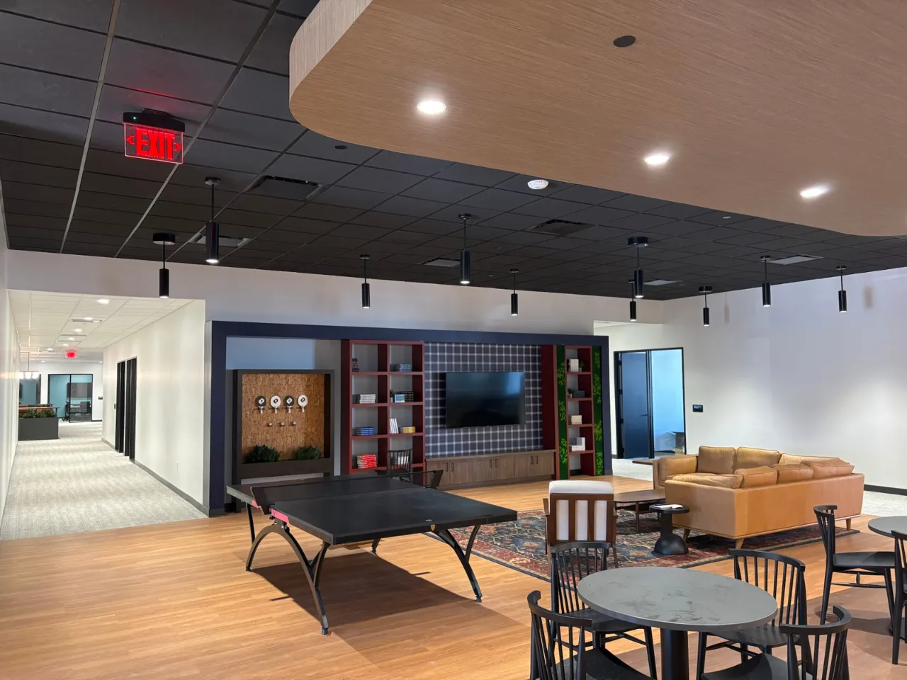Lobby and collaboration lounge at Power Home Remodeling Group’s Cincinnati regional office, featuring modern finishes and open gathering spaces built by Oswald Company.