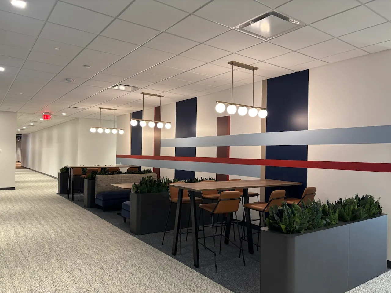 Collaboration seating at Power Home Remodeling Group’s Cincinnati regional office, featuring modern finishes and open gathering spaces built by Oswald Company.