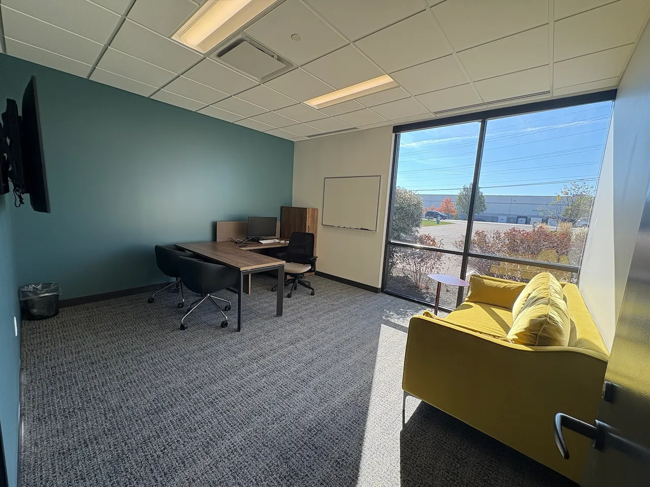 Office with lots of natural light built by Oswald Company.