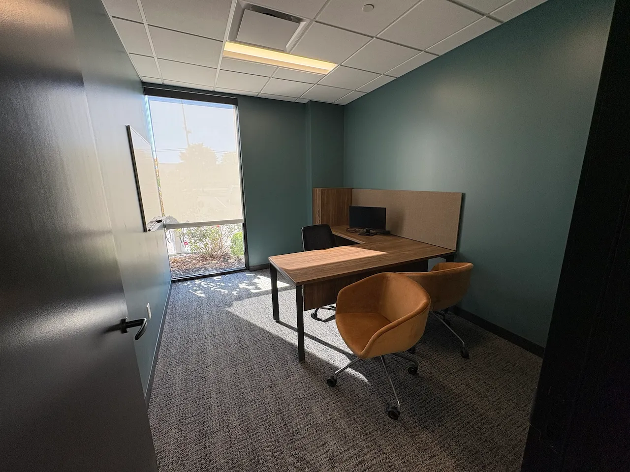 Office with lots of natural light built by Oswald Company.