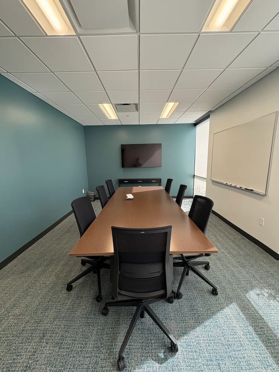 Conference room with branded walls built by Oswald Company.