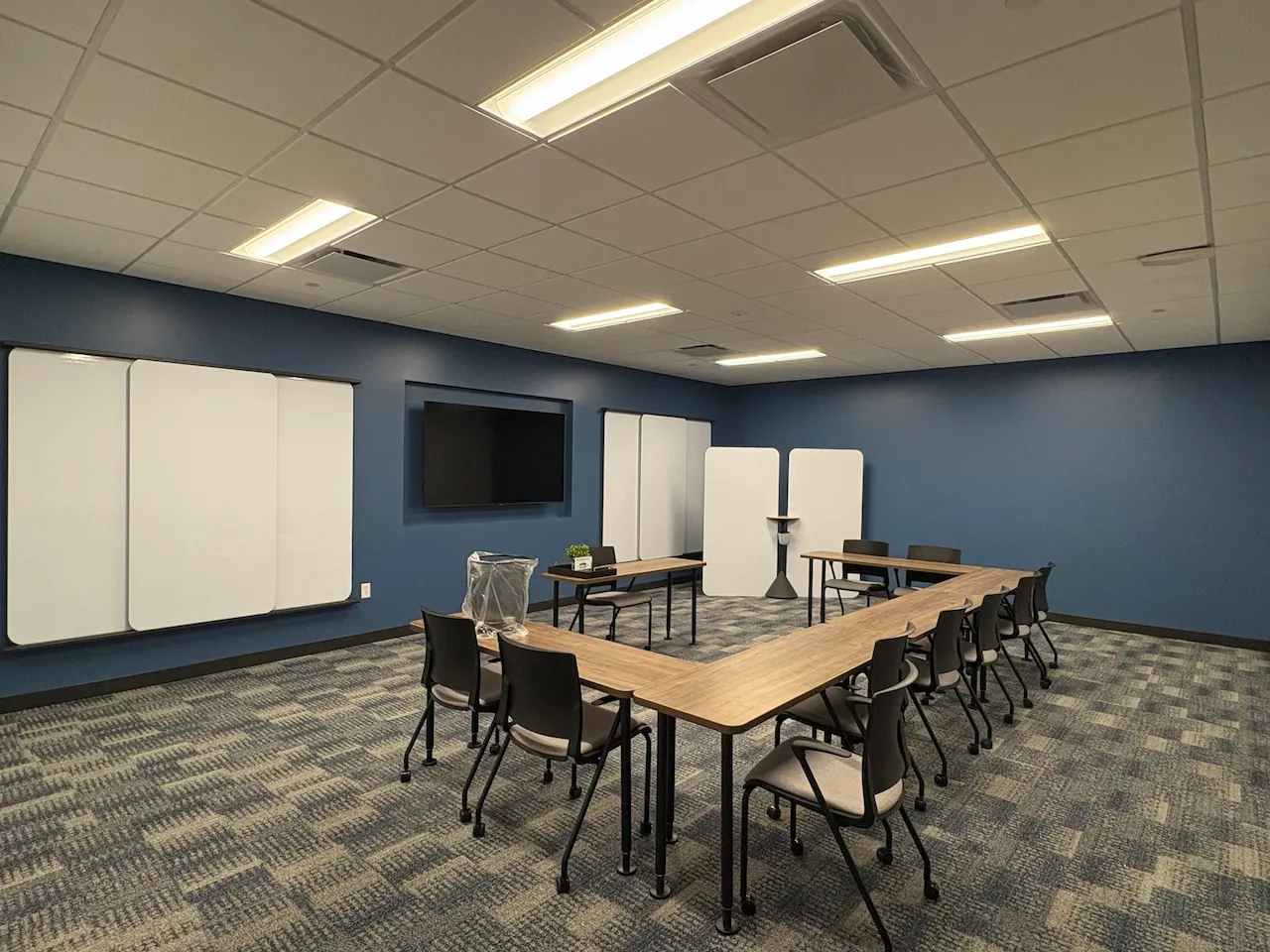 Training and classroom area designed for team education and onboarding at Power HRG’s Cincinnati office, built by Oswald Company.