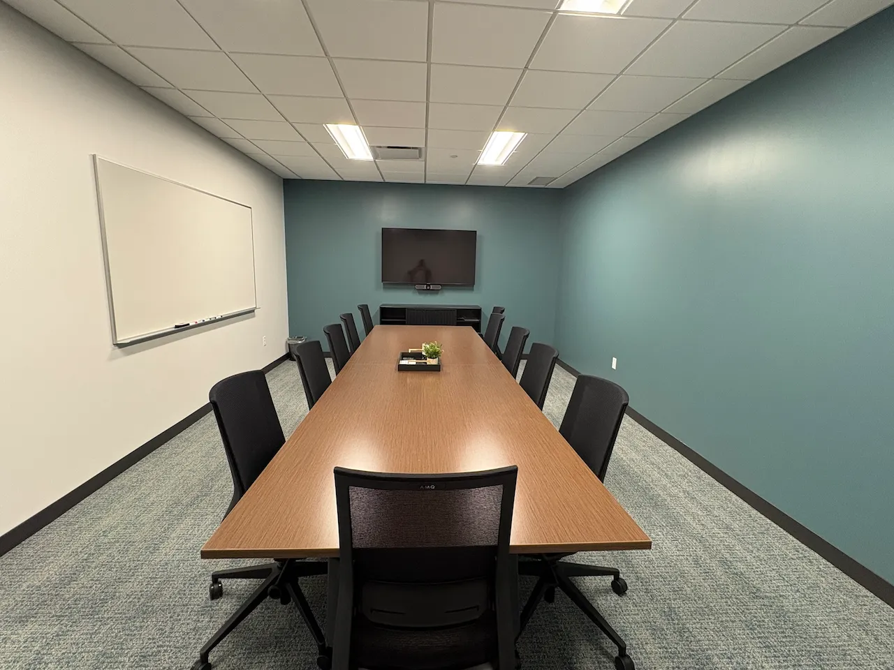 Conference room with branded walls built by Oswald Company.