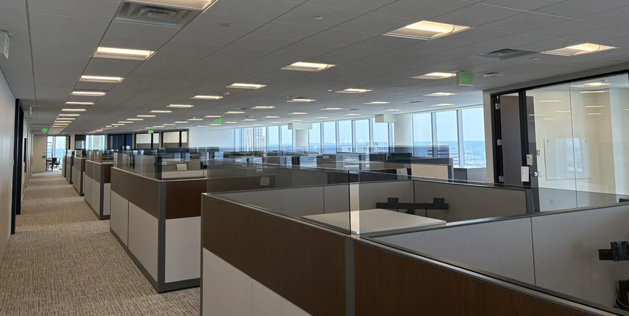 Contemporary cubicle office space by Oswald Company.