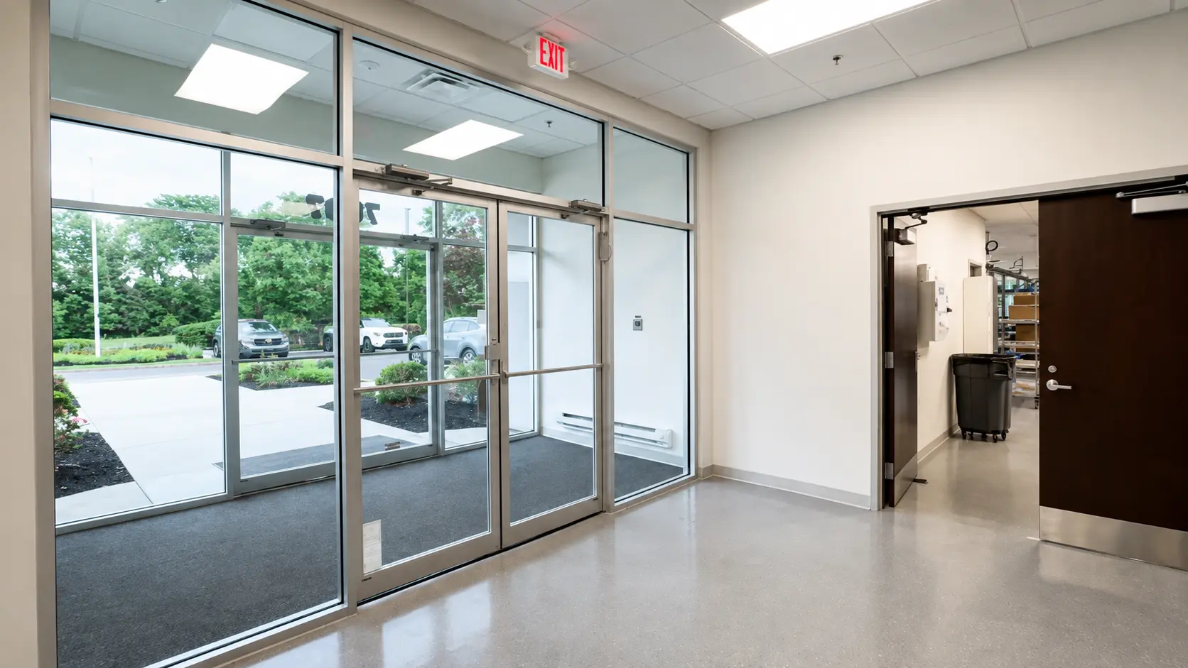 Entrance to AtriCure's MDC with large windows and tall ceilings.
