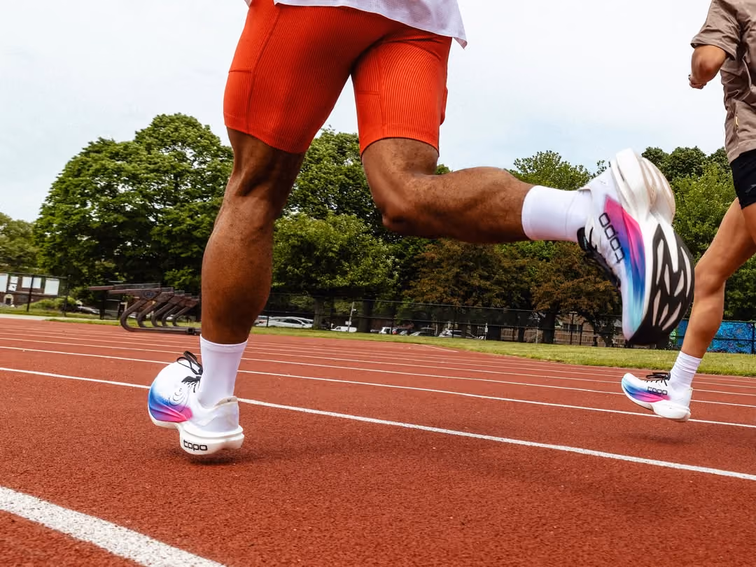 Runner mid-stride on a track