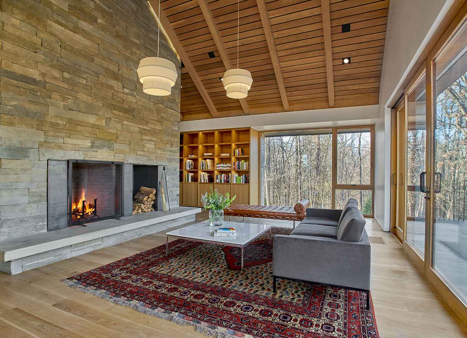 Sitting area with fireplace in the Loghaven Gateway Building and Artist Studios by Johnson & Galyon.