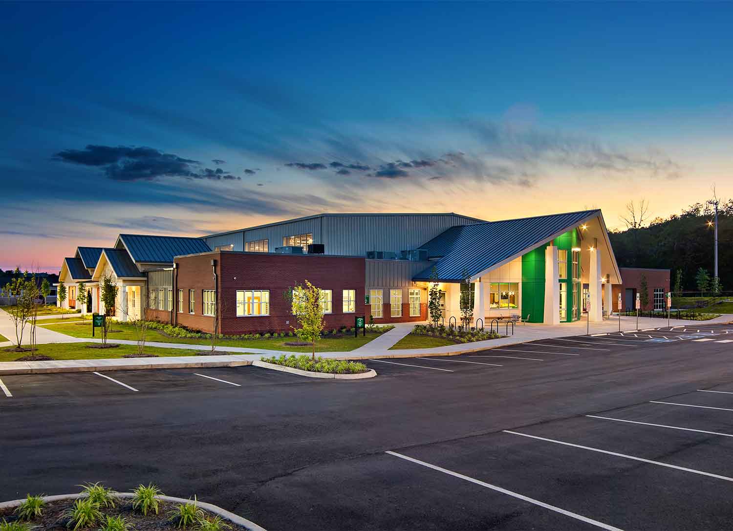 Exterior view at night of the Emerald Youth Haslam-Sansom Ministry Complex by Johnson & Galyon