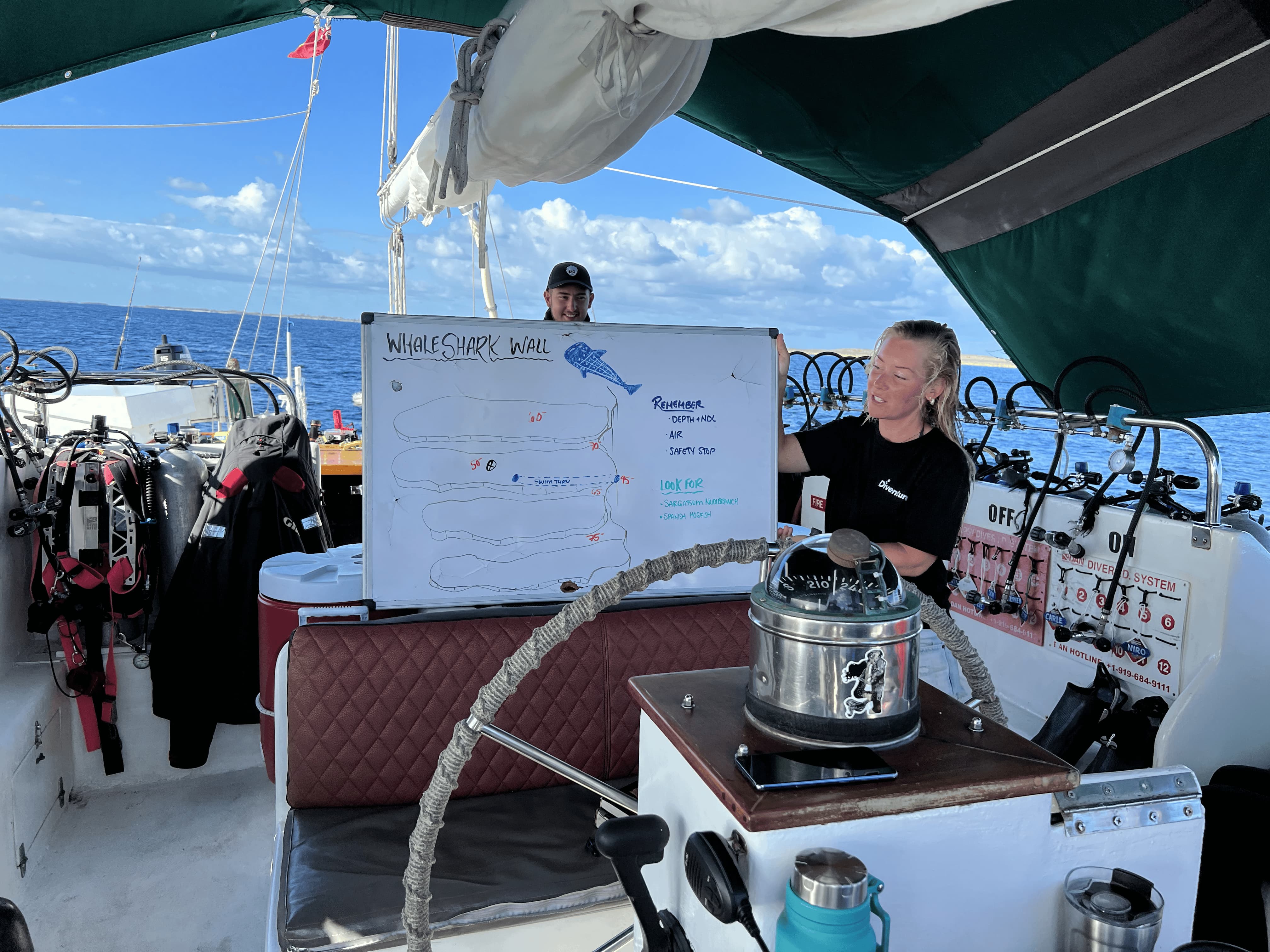 Crew running a dive site briefing on deck, Blackbeard's Cruises, Bahamas