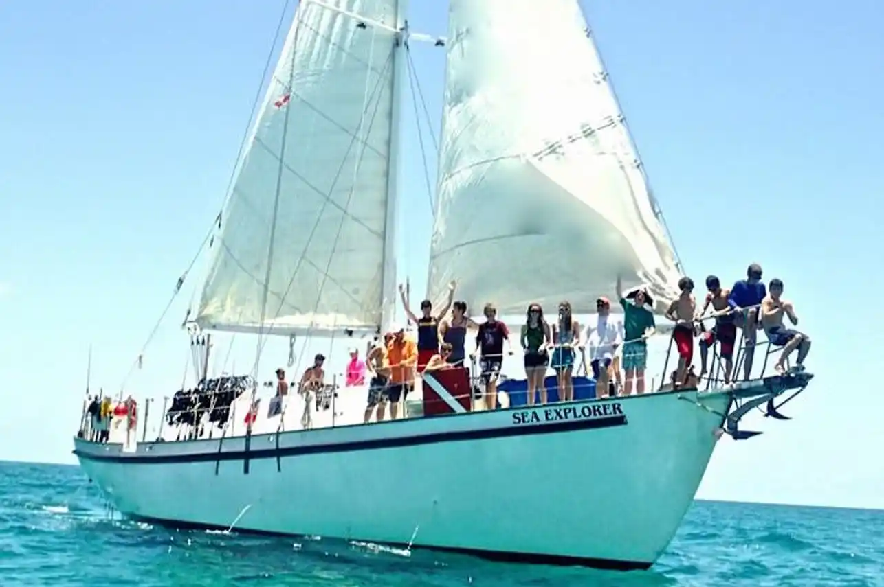 The Sea Explorer under full sail with guests on the bow, Blackbeard's Cruises, Bahamas