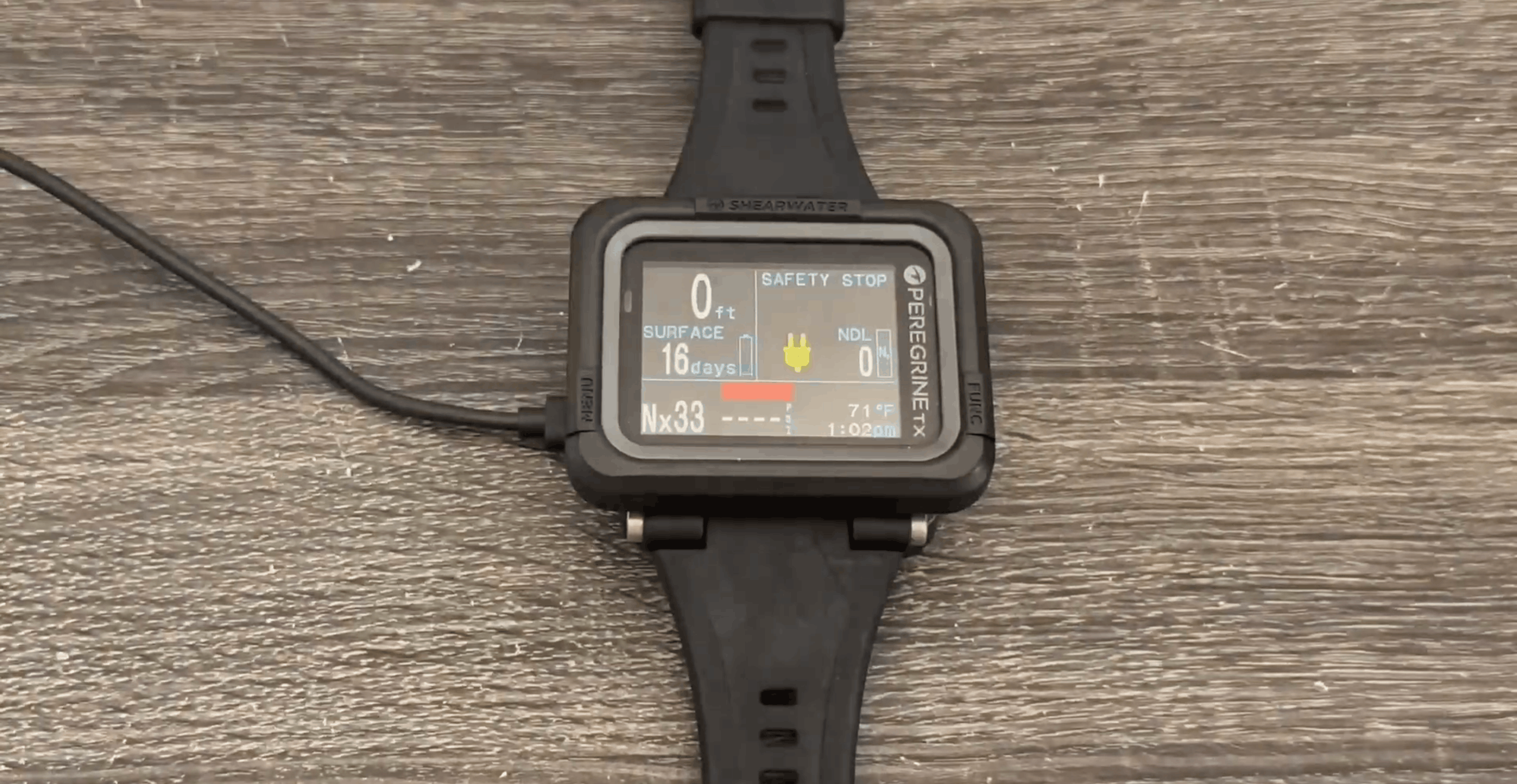 Shearwater Peregrine TX on its wireless magnetic charging pad
