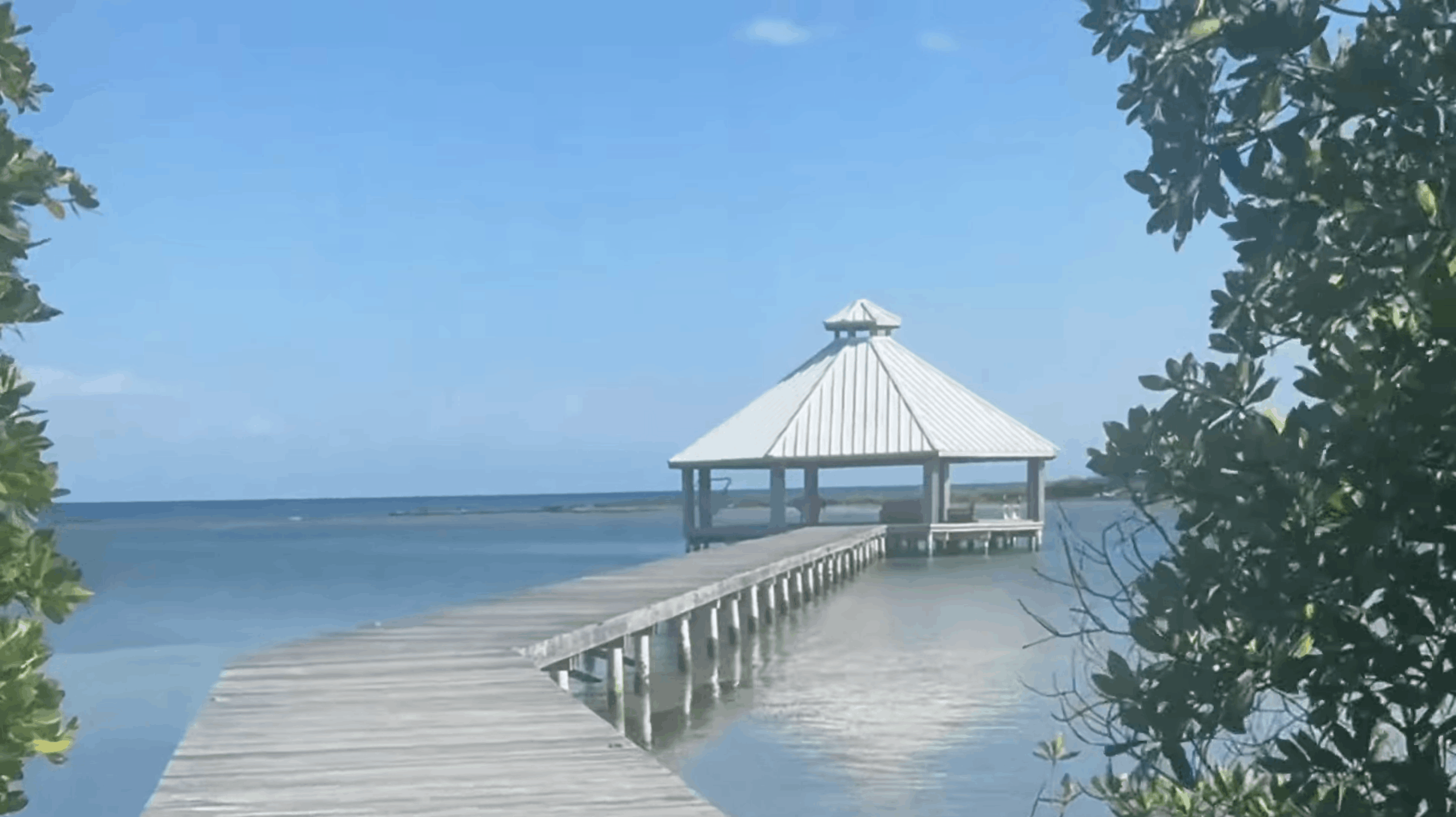 Dock and pavilion over the water at Barefoot Cay Resort, Roatán, Honduras