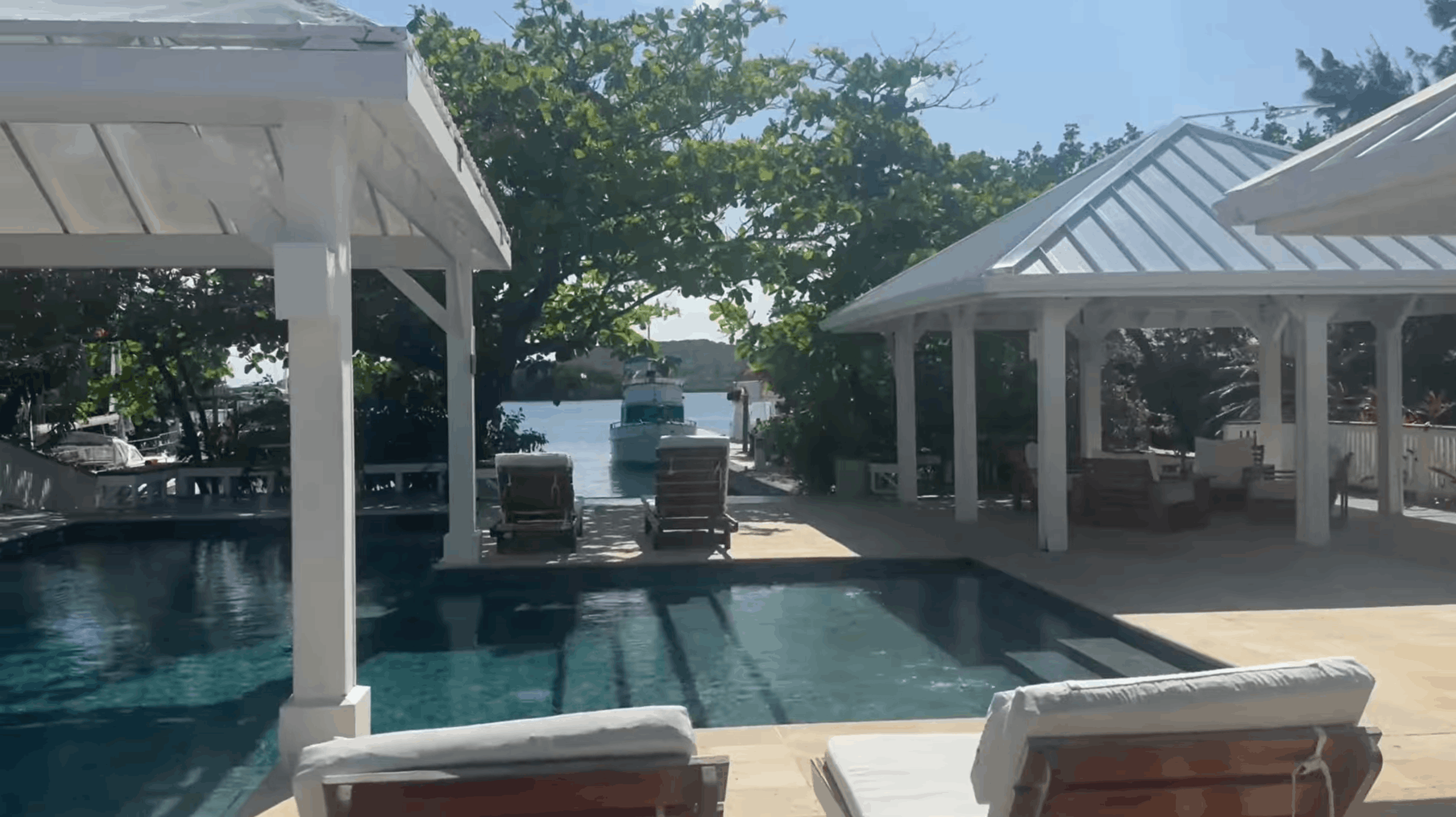 Pool and cabanas on the private island at Barefoot Cay Resort, Roatán, Honduras