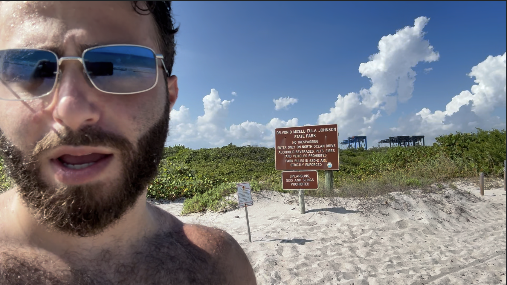 Divemaster Austin at the Dr. Von D. Mizell-Eula Johnson State Park sign, Dania Beach