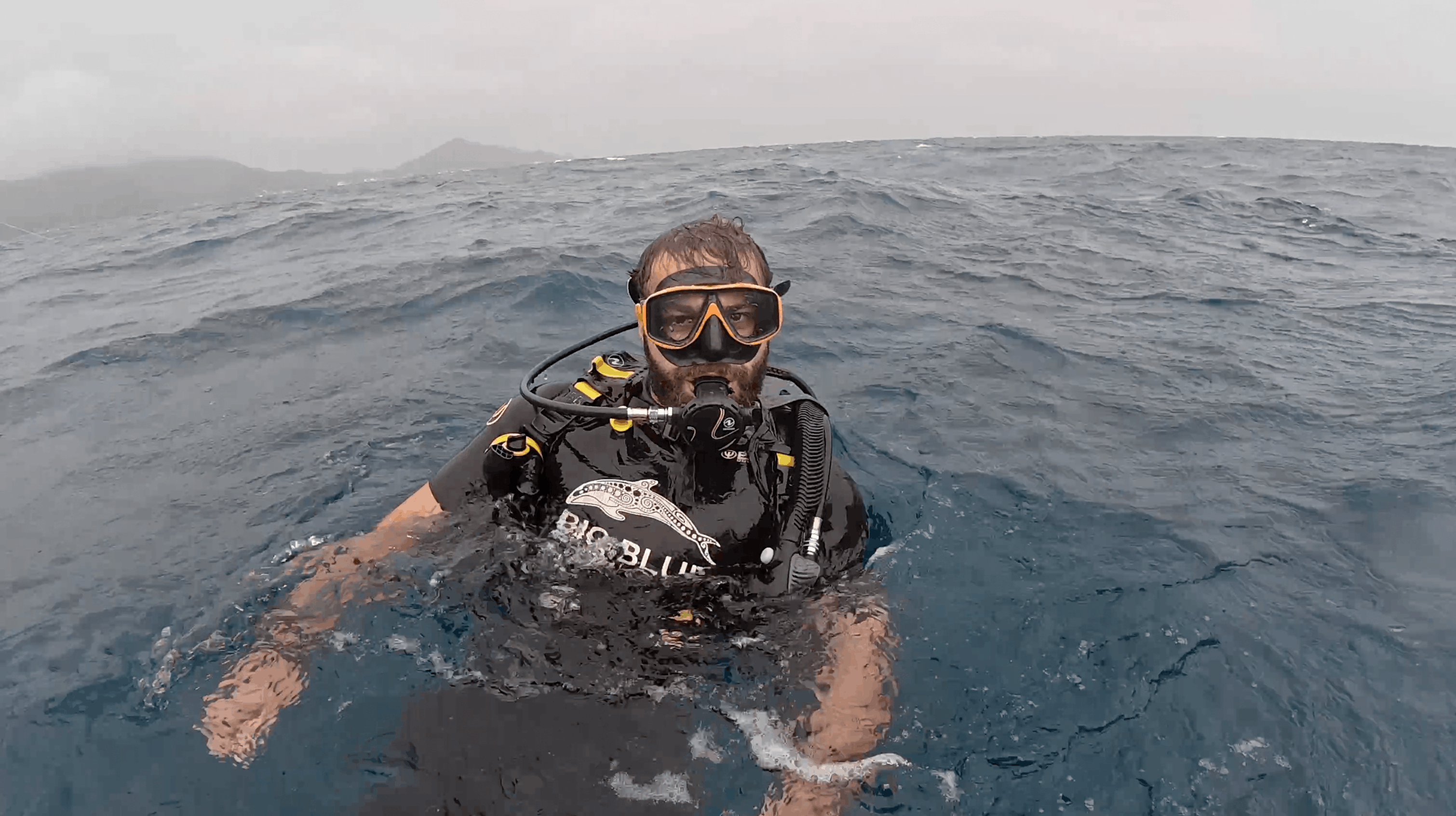 Divemaster Austin at the surface in a Big Blue Diving BCD before the HTMS Suphairin dive, Koh Tao