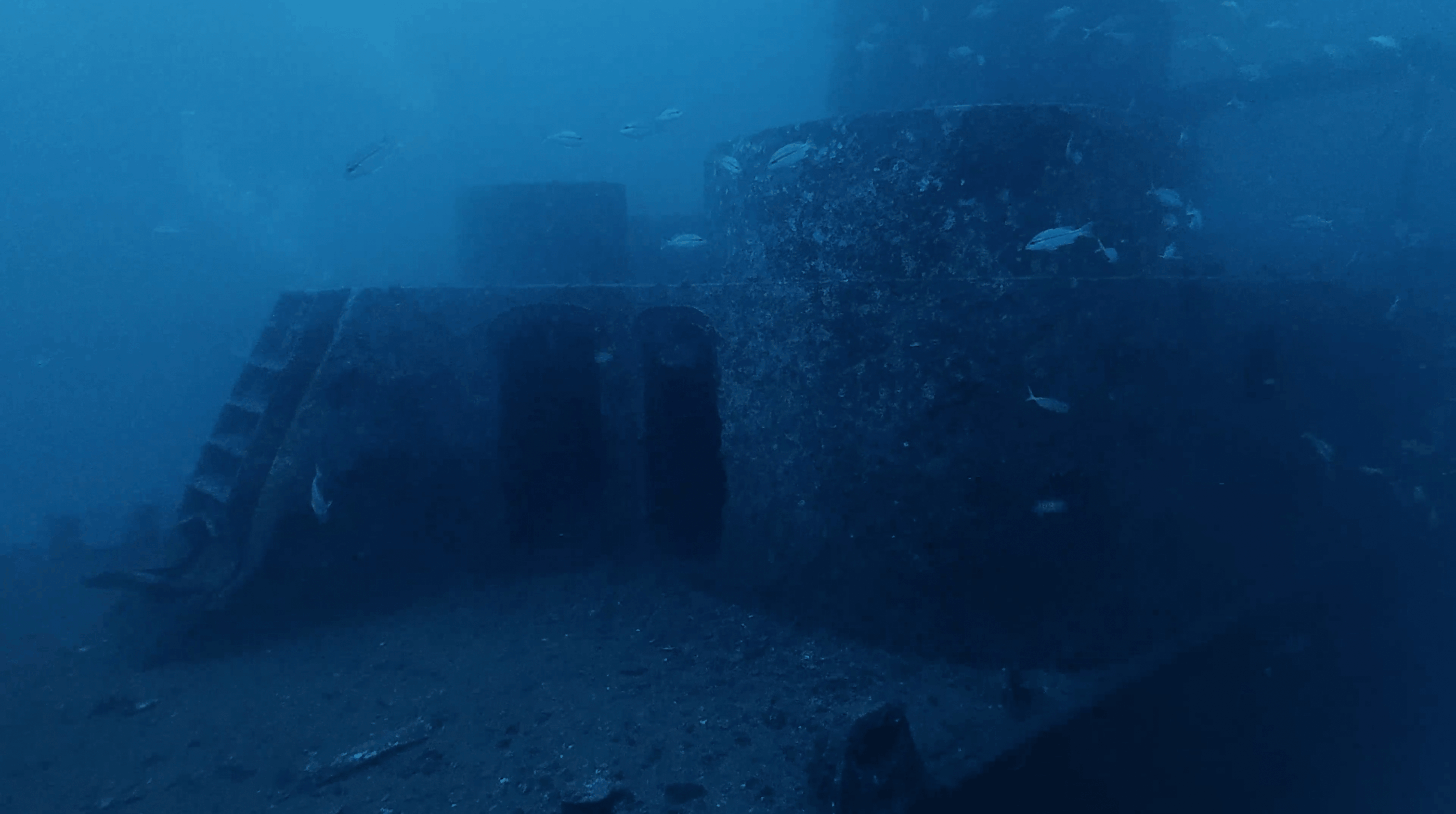 Encrusted superstructure and gun mount on the HTMS Sattakut wreck, Koh Tao