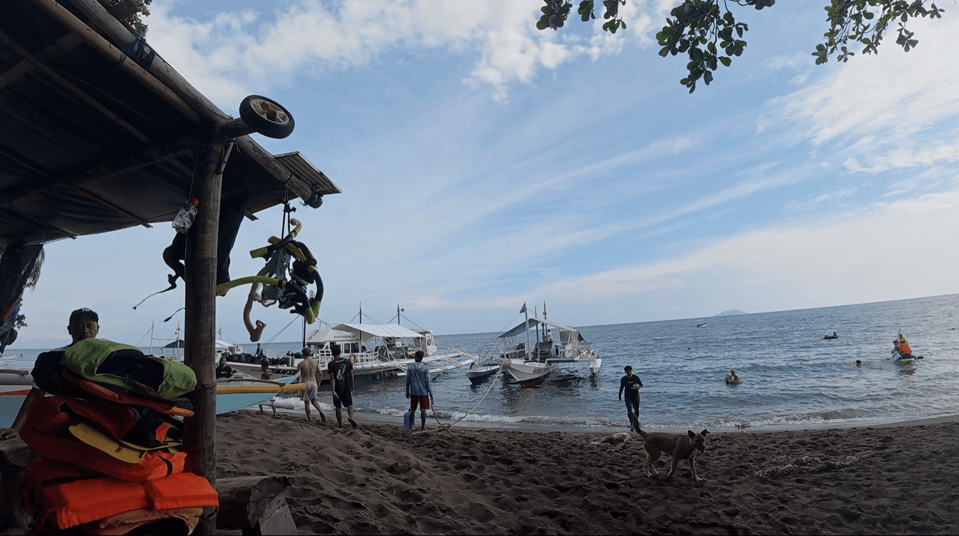 Boats and the beach entry at District One, Dauin, Philippines