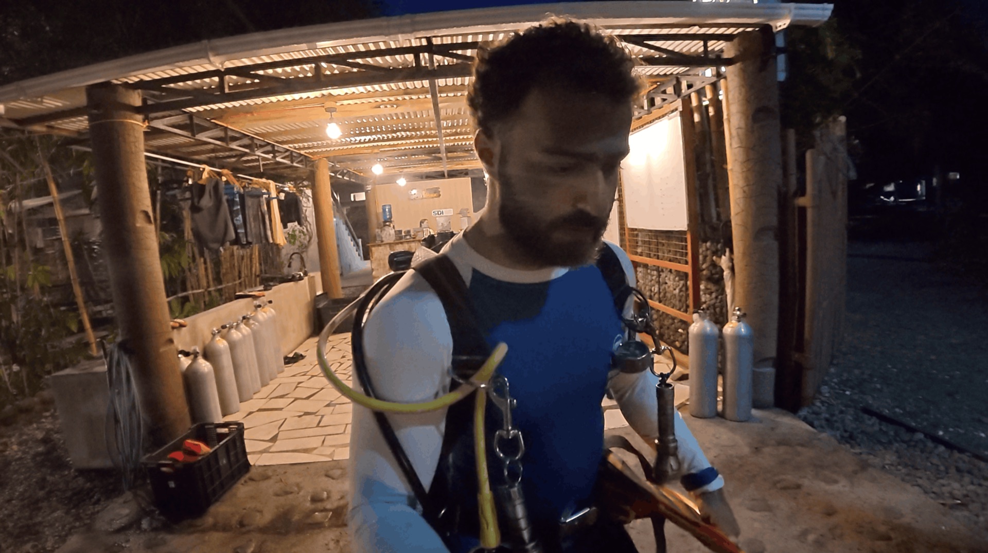 Divemaster Austin in his scuba gear at the dive center before the night dive at Critter Republic House Reef, Dauin, Philippines