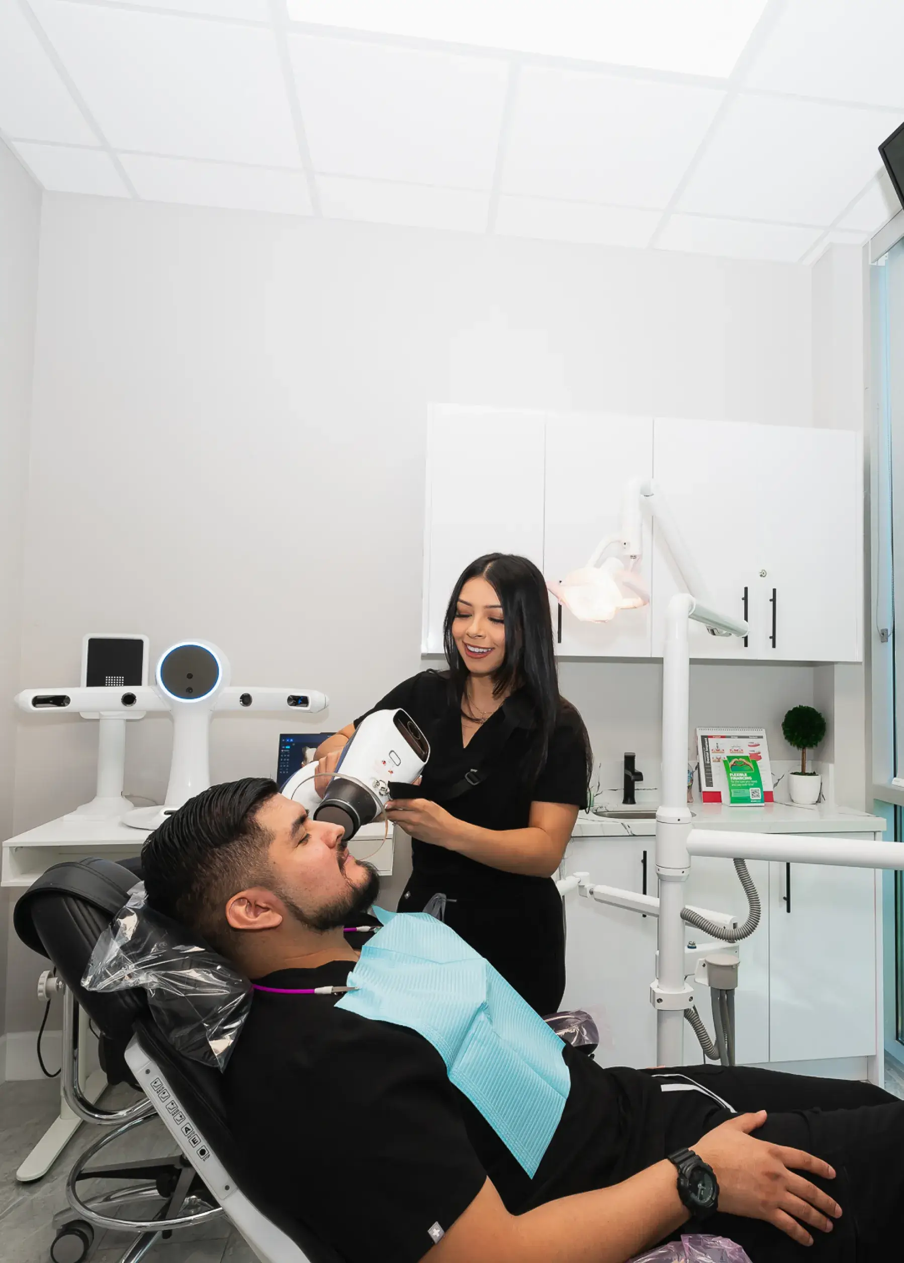 A man getting his hair cut by a woman.
