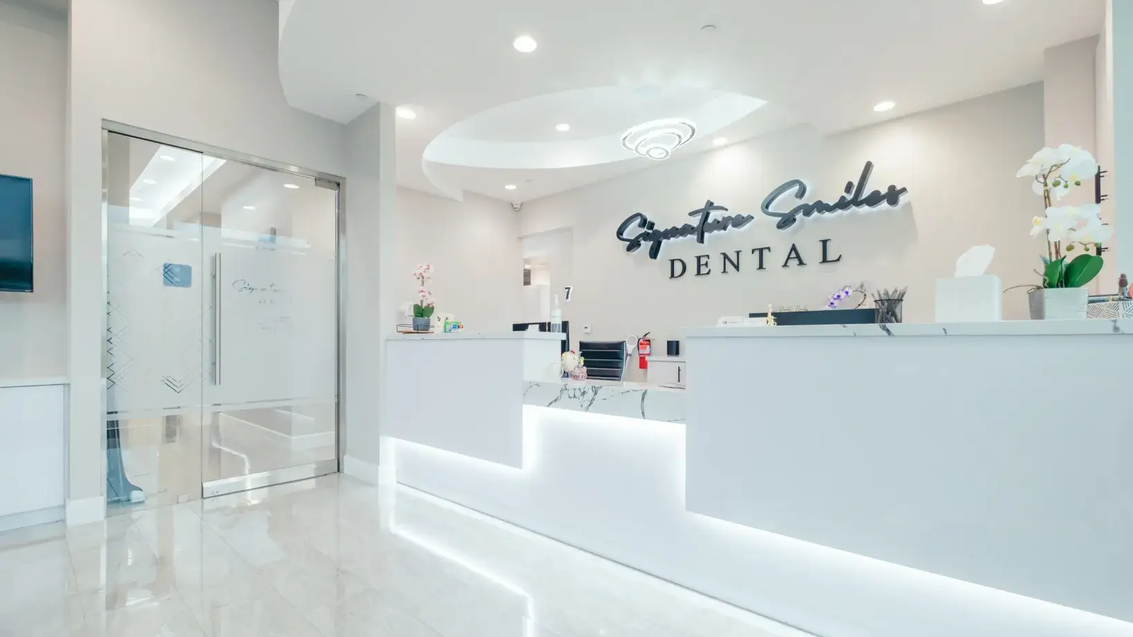 A dental office with a white reception counter.