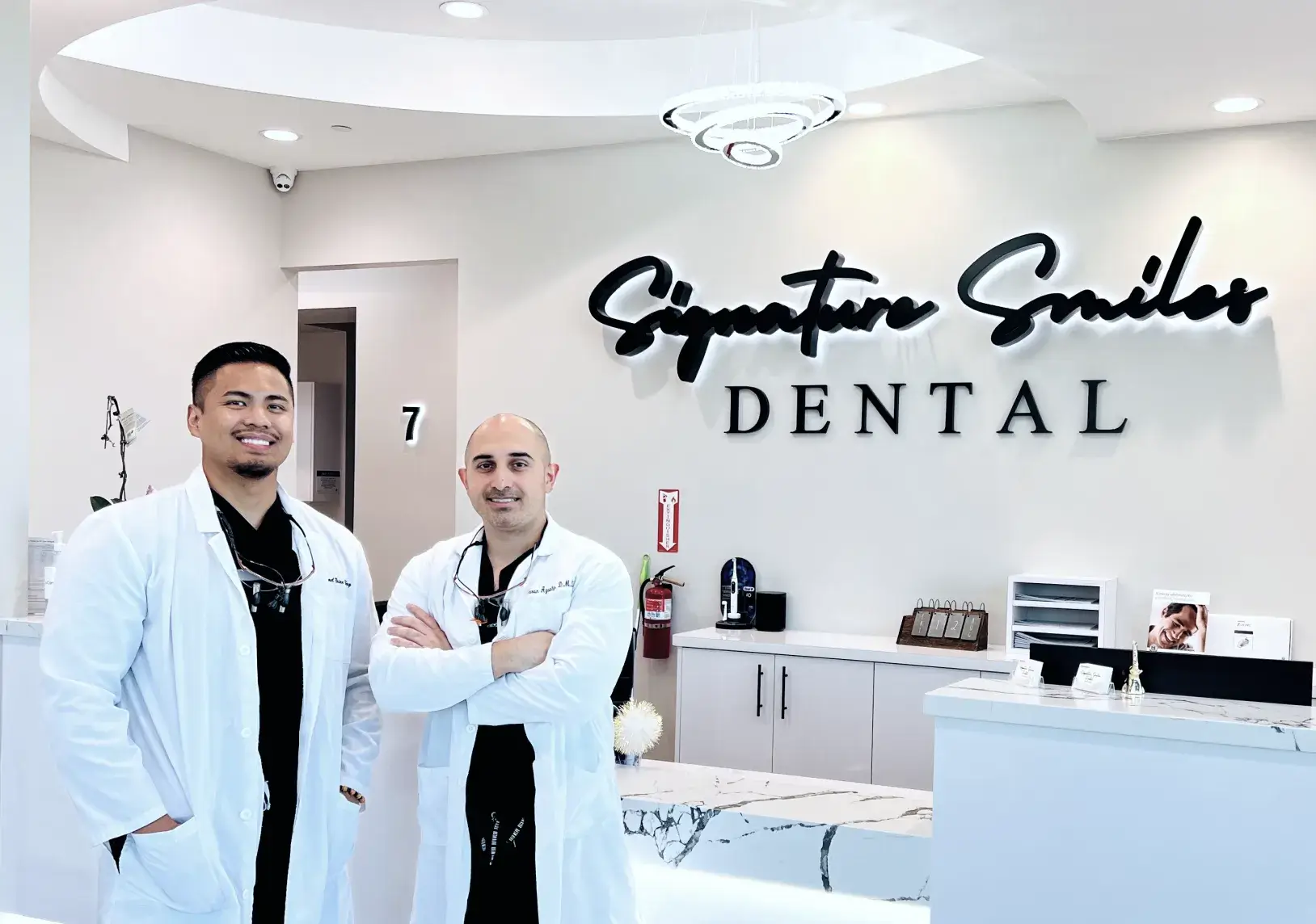 Two men standing in front of a dental office.