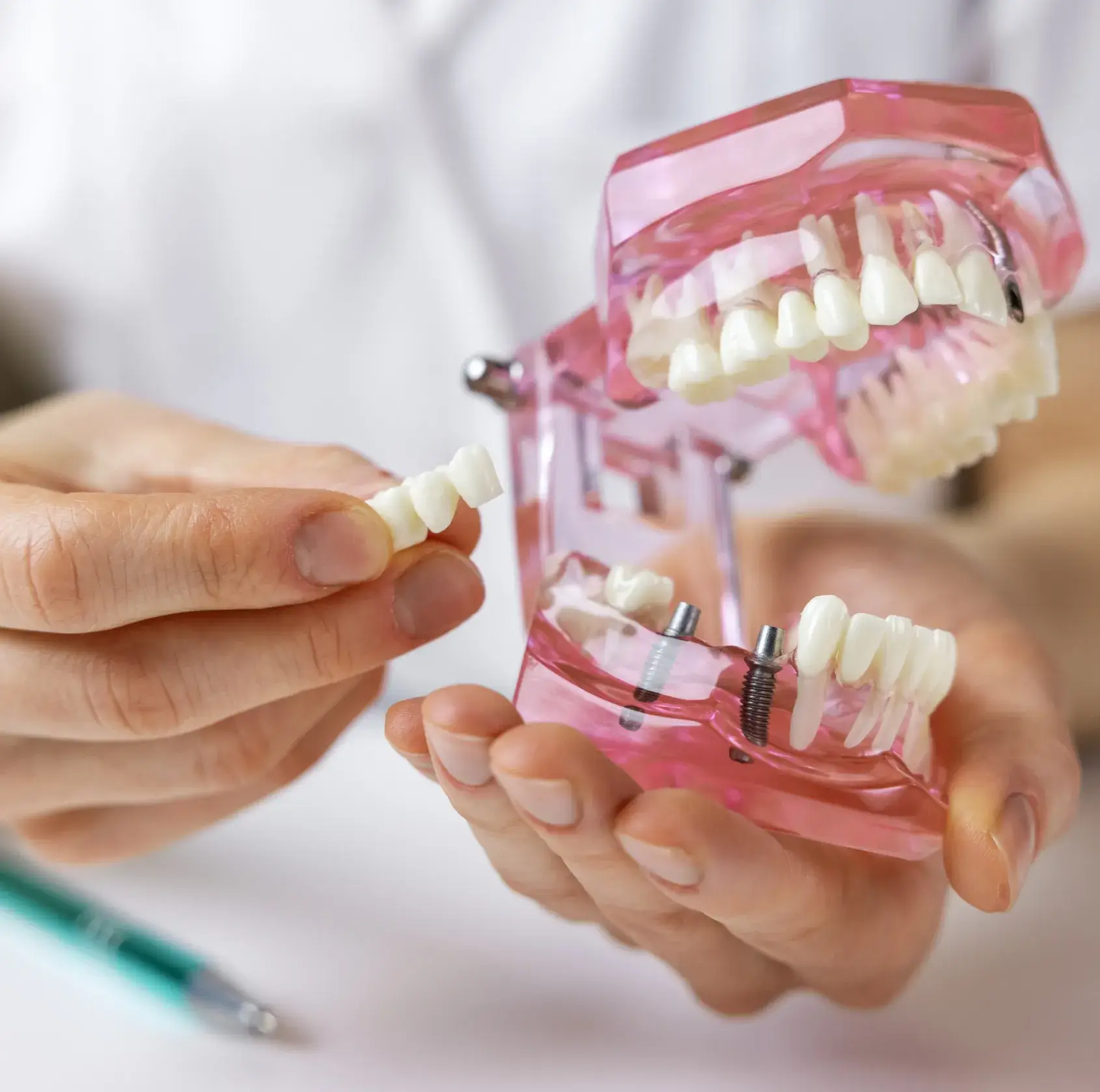 A person holding a toothbrush in their hands.