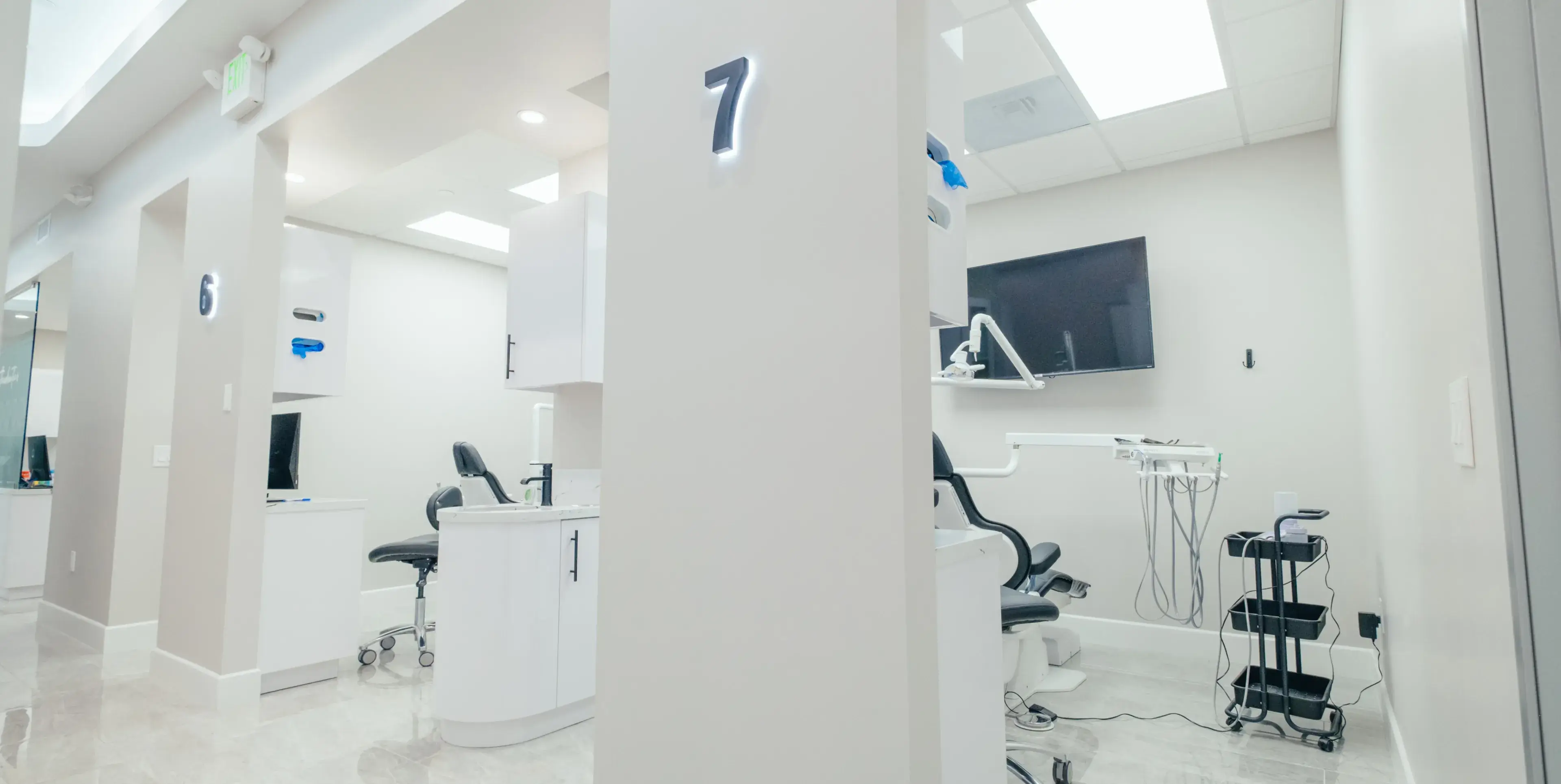 A room filled with lots of chairs and a flat screen tv.