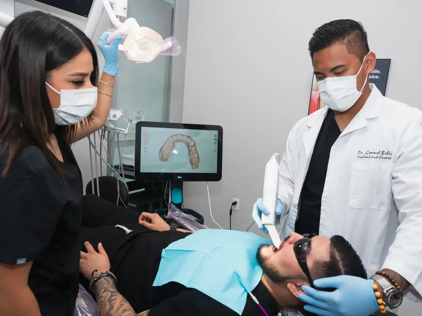 A man getting his teeth checked by a dentist.