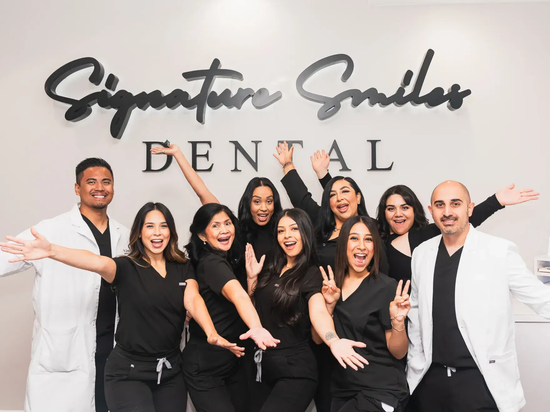 A group of dental professionals posing for a picture.