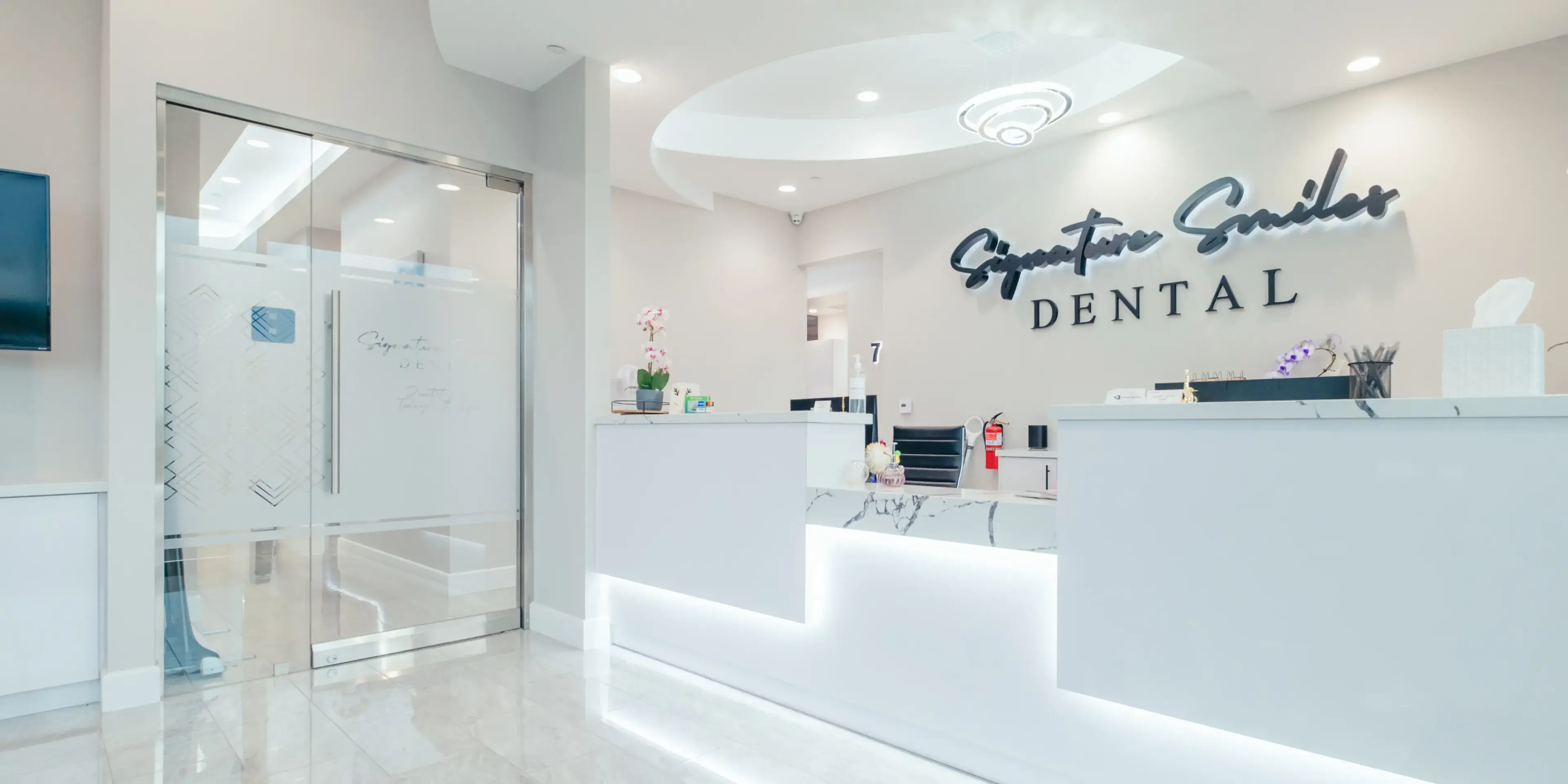 A dental office with a white reception counter.
