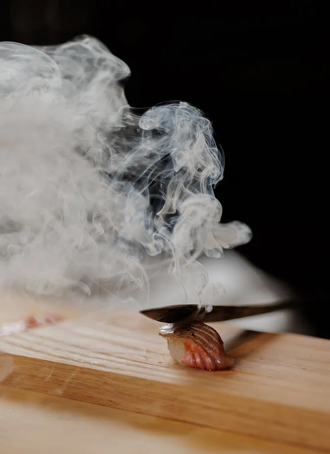 Instagram image featuring a hot knife pressing against fish.