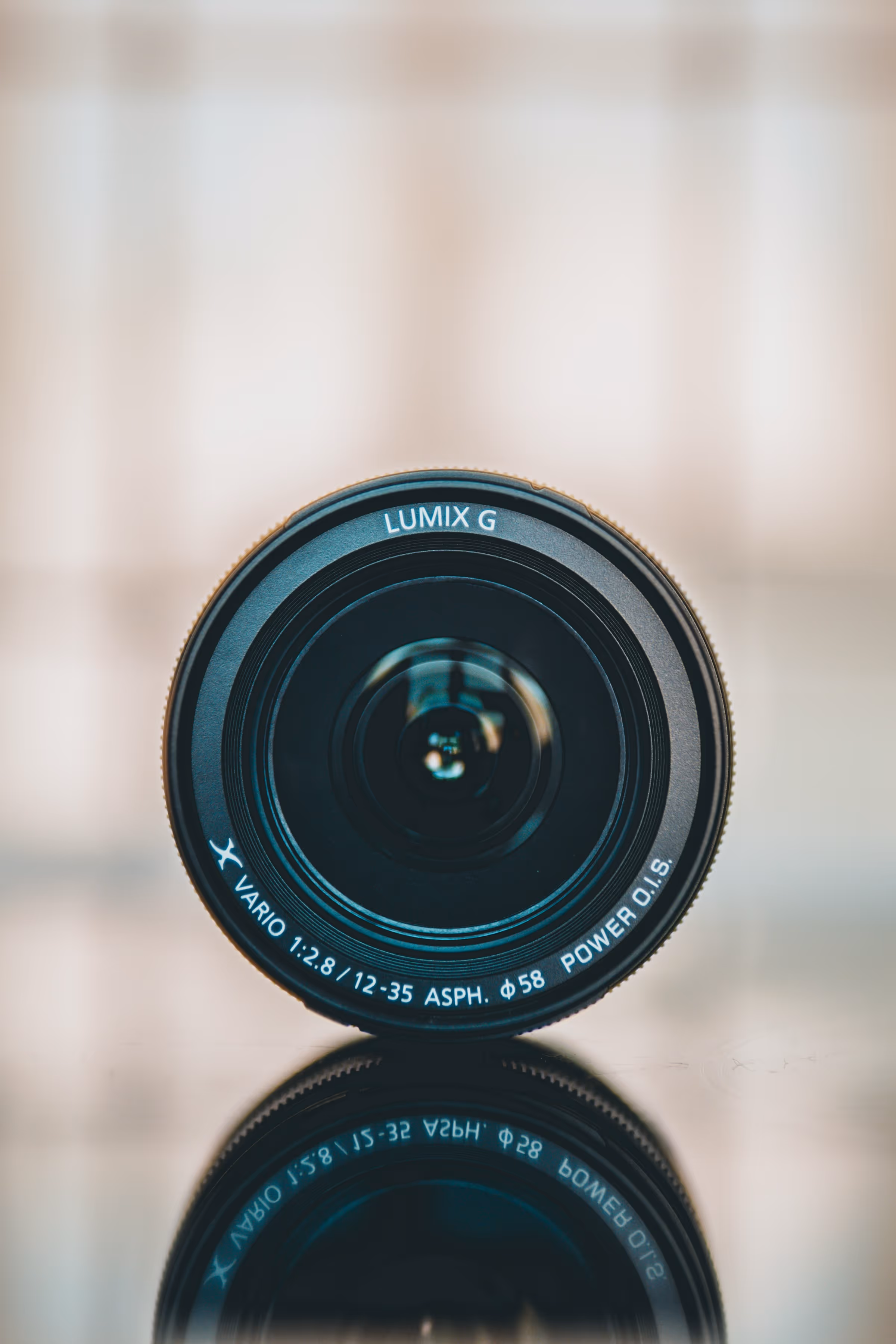 Close-up of a Lumix G camera lens, symbolizing precision, creativity, and storytelling in wedding cinematography.