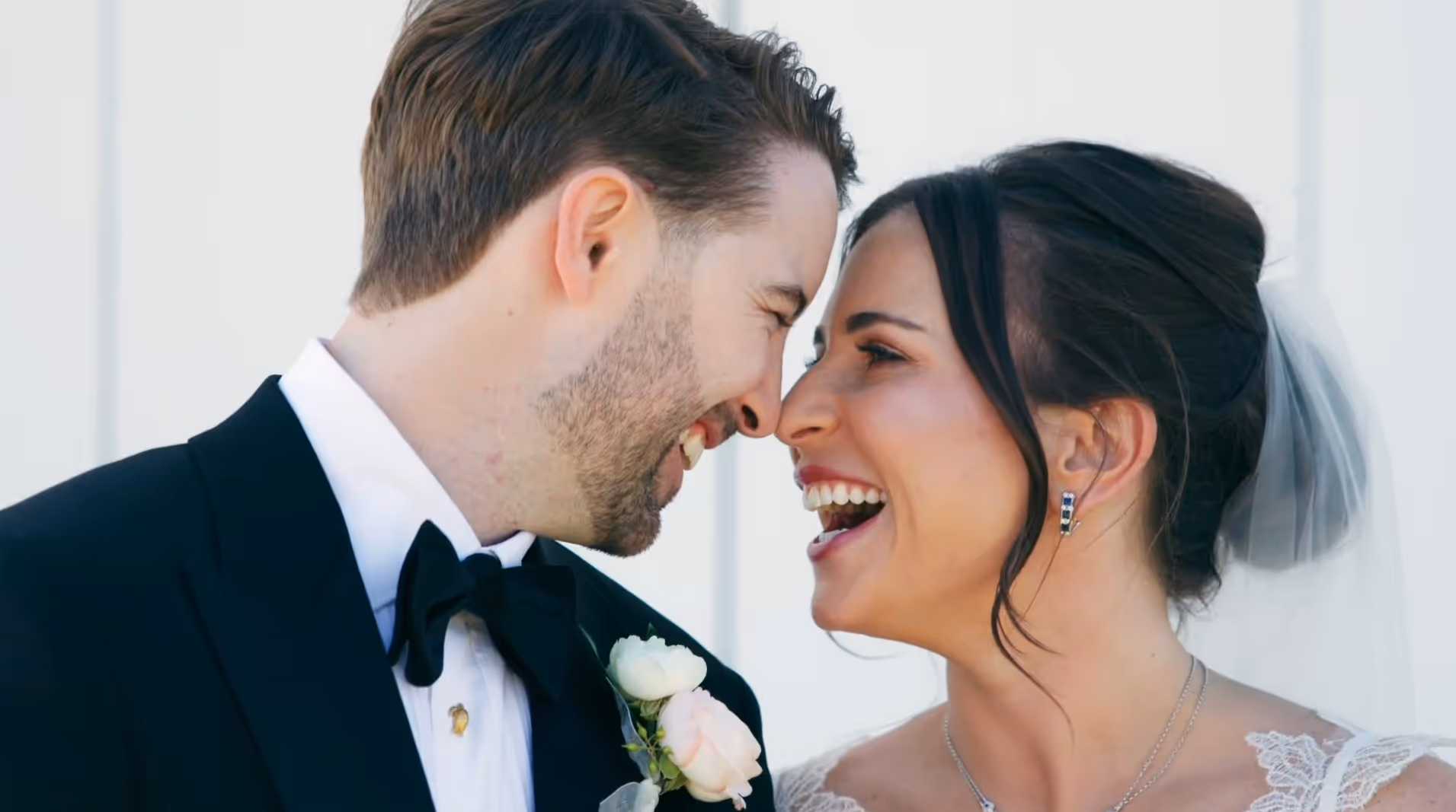 Bride and groom laughing together in bright natural light — joyful moment from Charles and Chesley’s cinematic wedding film, filmed in the USA.